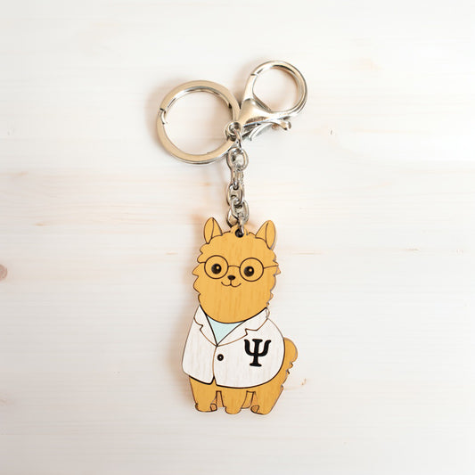 Llavero Alpino con diseño de Alpaca Psicóloga en madera MDF